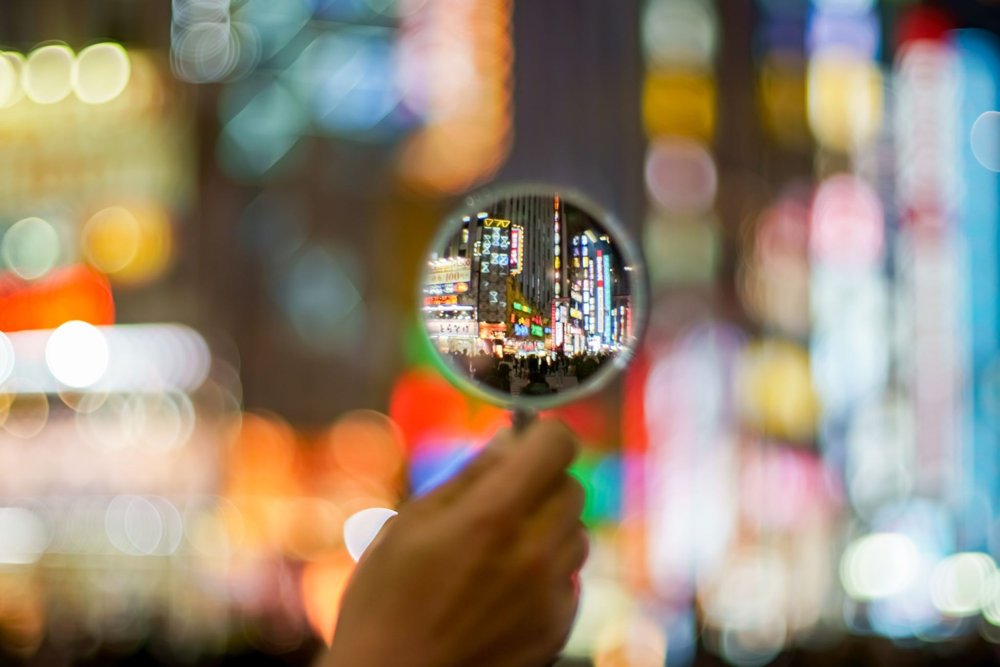 City-lights-focused-in-magnifying-glass